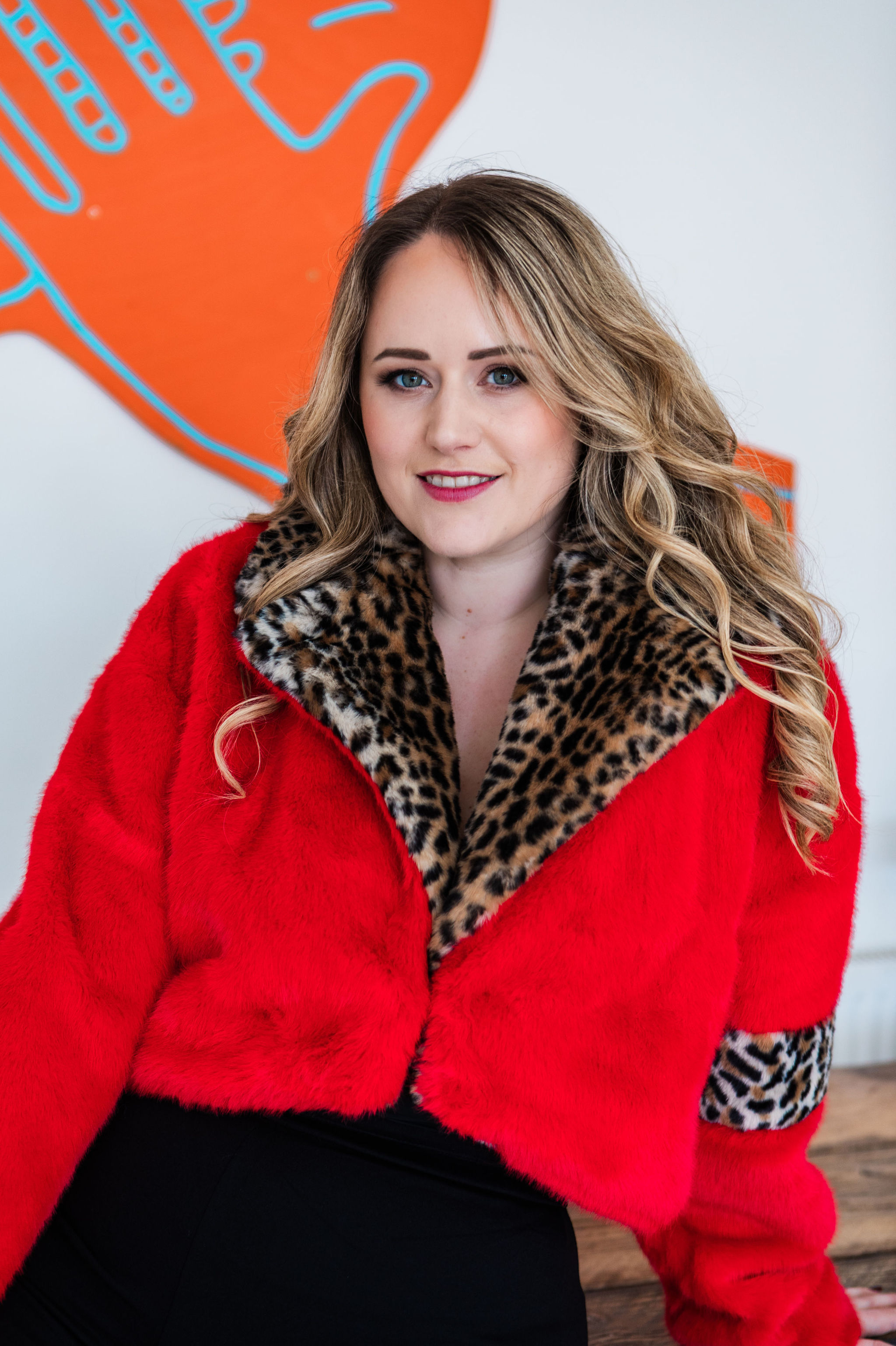 Chantelle in a red faux-fur jacket